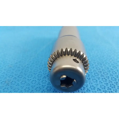 Stryker 1/4 inch silver metallic surgical drill bit with gear-like fluted edge and hexagonal drive socket for reuse medical orthopedic instruments