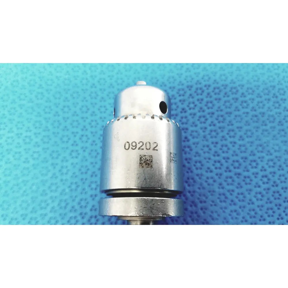Silver-colored metal stryker 1/4 in. keyed chuck with knurled grip and serial number 09202 for reuse medical use