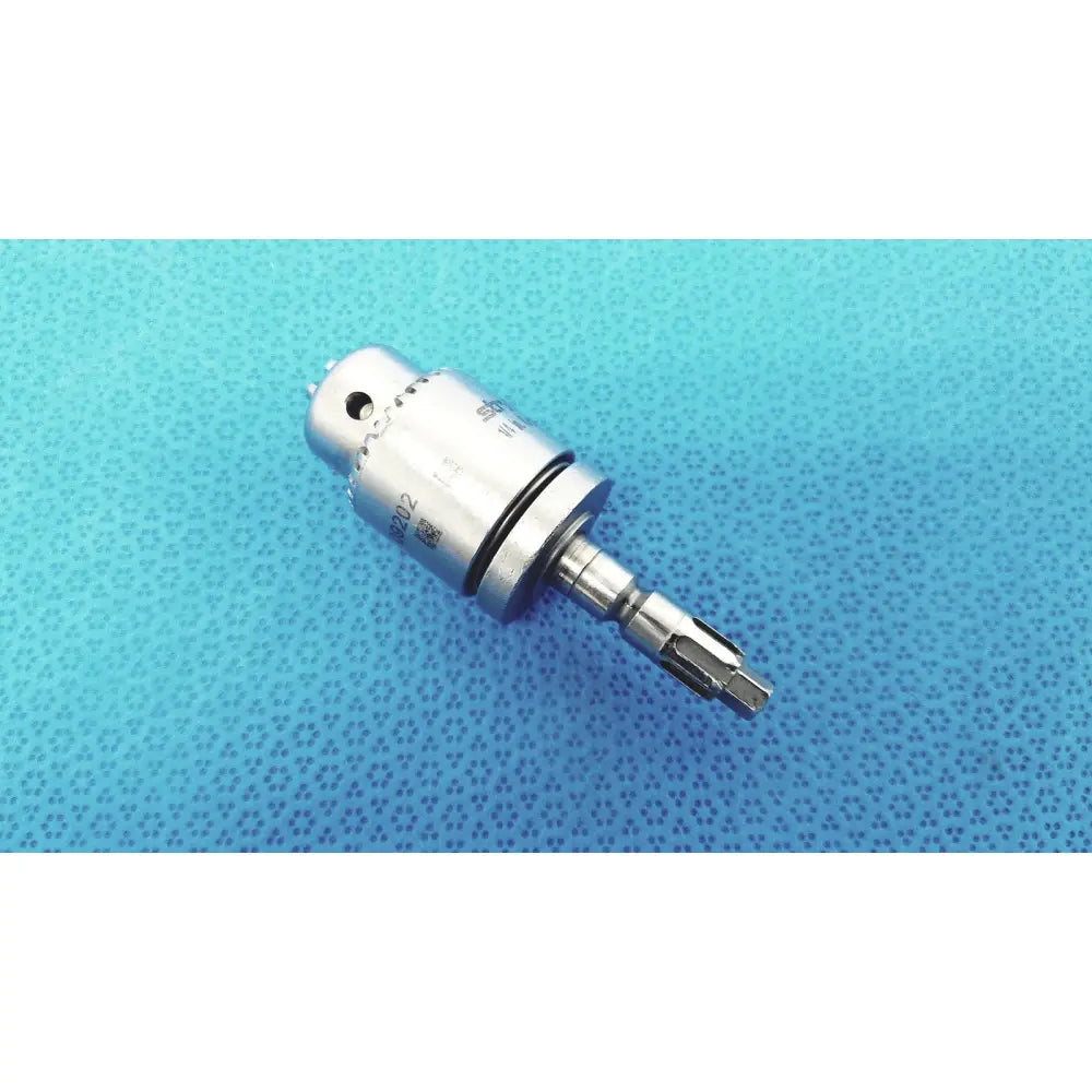 Silver-colored metal surgical drill bit with hexagonal shank and engraved markings for stryker 1/4 in. keyed chuck reuse medical