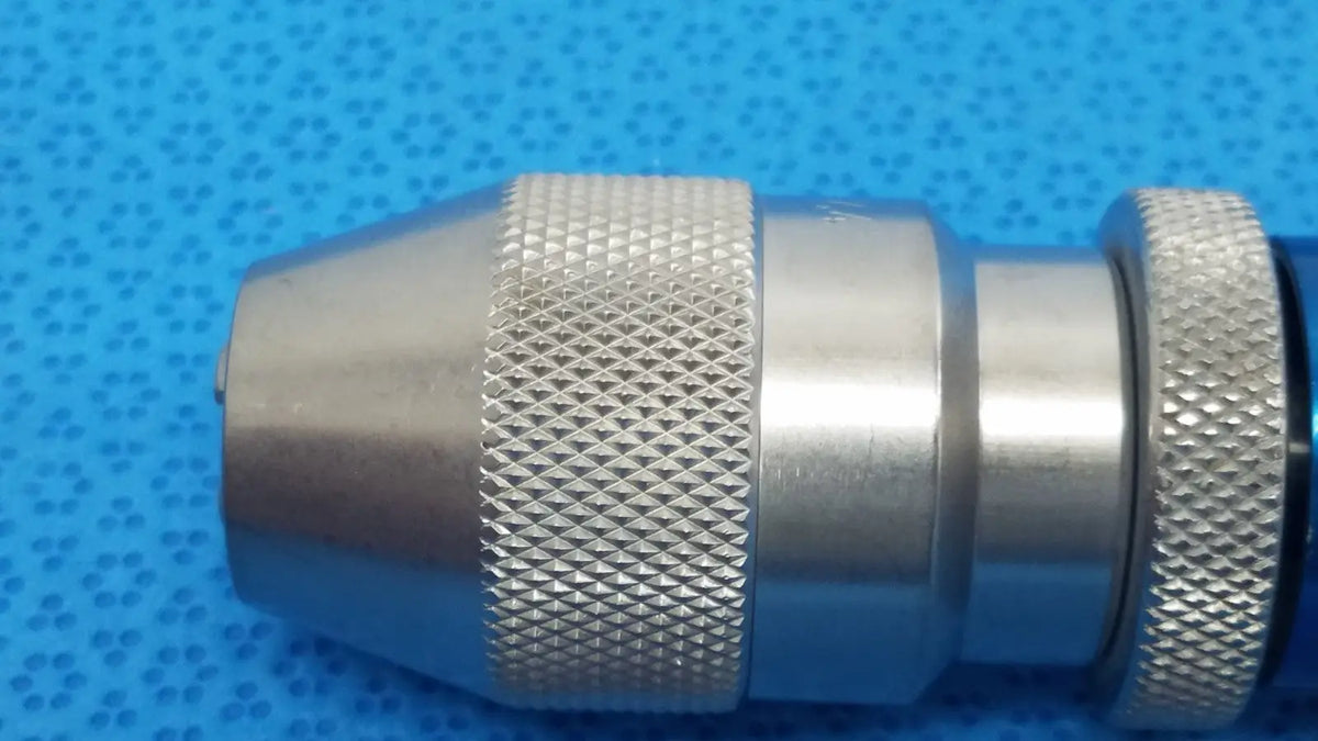 Silver metallic stryker 1/4 keyless drill chuck with textured grip for reuse medical applications