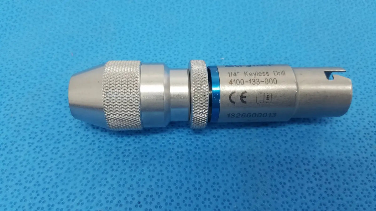 Stryker 1/4 keyless drill metal with textured grip and blue accent band designed for reuse medical applications