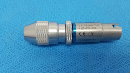 Stryker 1/4 keyless drill metal with textured grip and blue accent band designed for reuse medical applications