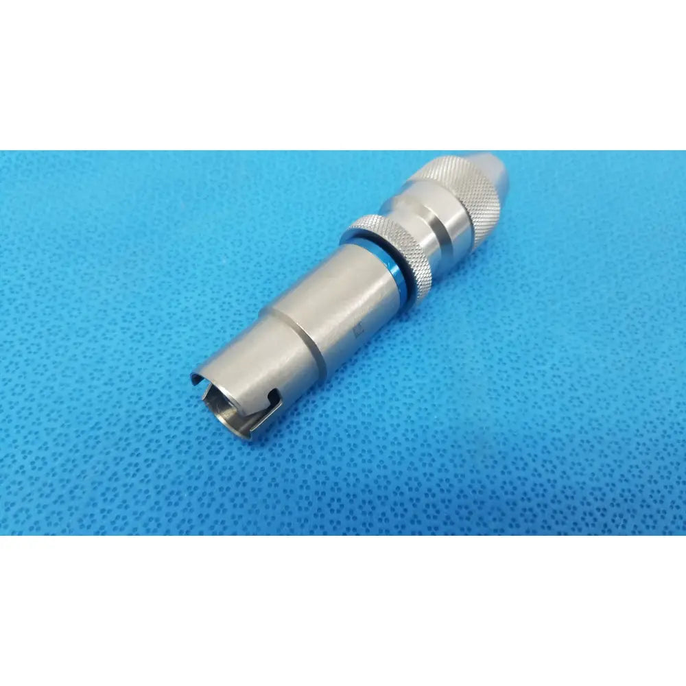 Stryker 1/4 keyless drill with silver metallic textured grip and blue accent ring designed for reuse medical applications