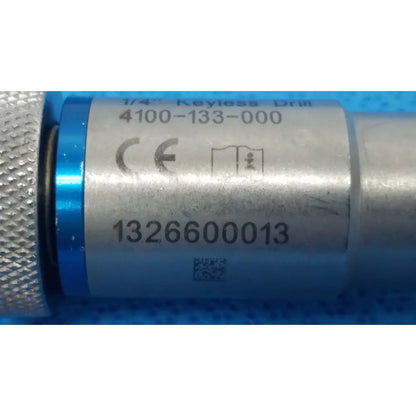 Silver metallic stryker 1/4 keyless drill with blue accent ring and engraved labeling for reuse medical applications