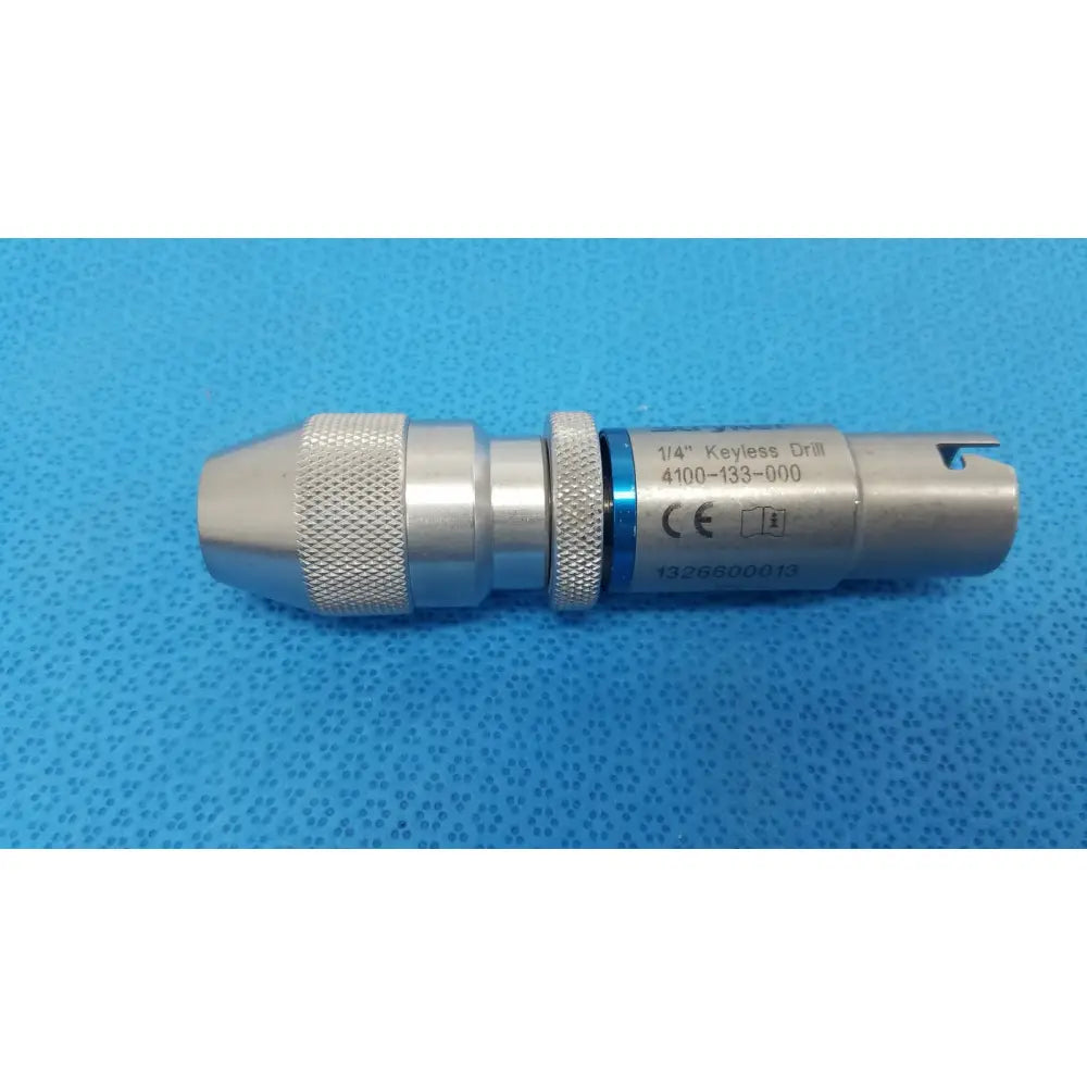 Stryker 1/4 keyless drill metal with textured grip and blue accent band designed for reuse medical applications