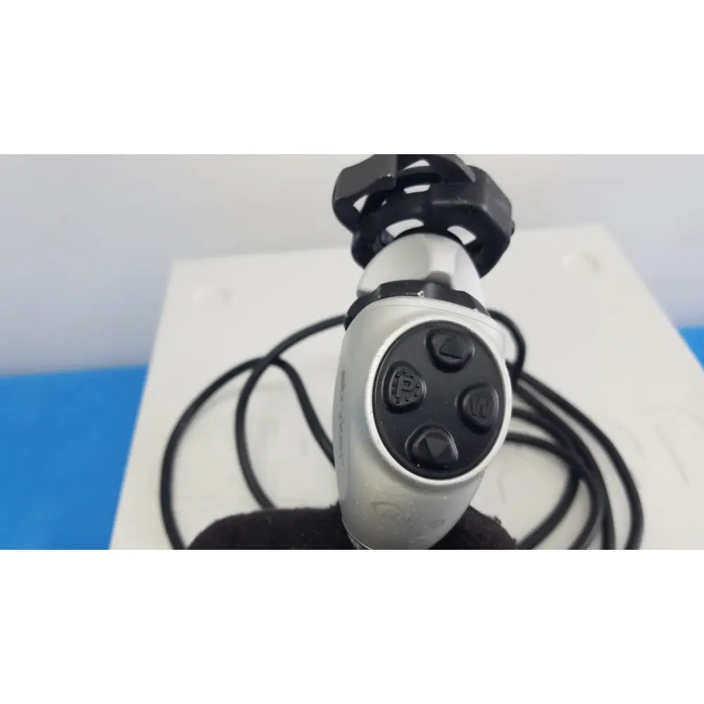 Silver and black handheld gaming controller with circular button layout for stryker 1488 hd camera system camera head reuse medical