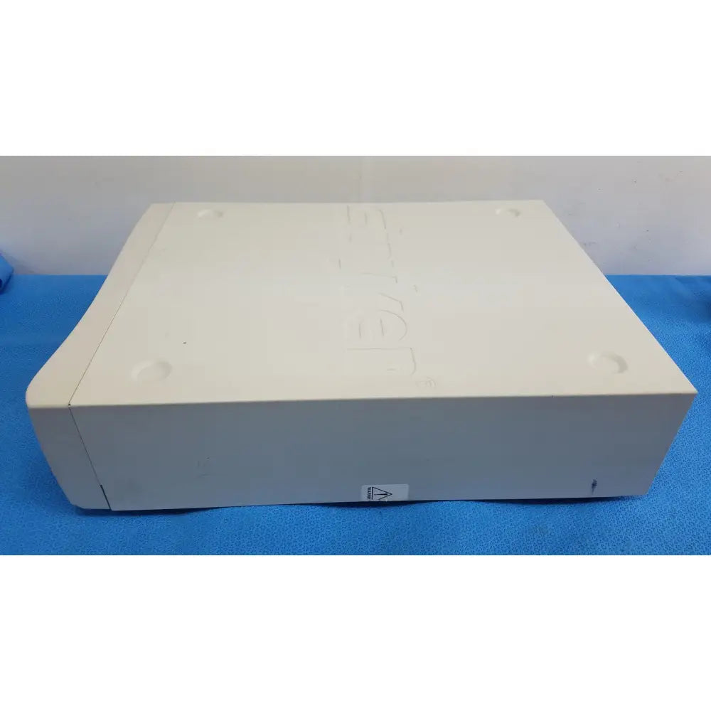 Off-white plastic xbox 360 console with embossed logo and rounded edges shown with stryker 1488 hd camera system camera head for reuse medical use