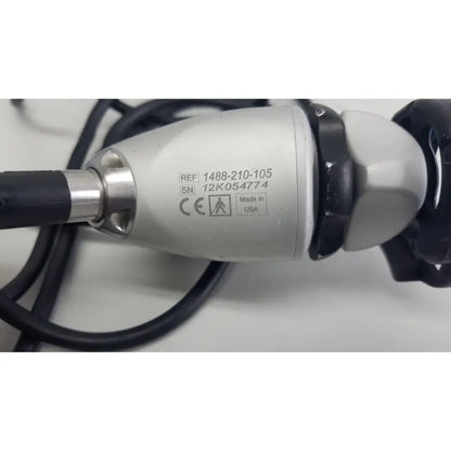 Silver and black Stryker 1488 hd camera system camera head with metallic handle labeled made in usa for reuse medical use
