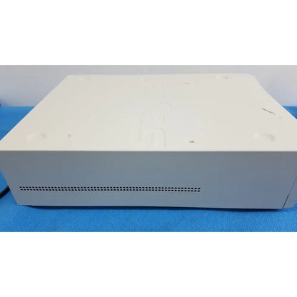 Off-white rectangular Stryker 1588 aim hd camera with perforated vent for reuse medical endoscopy applications