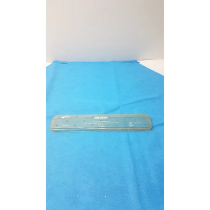 Transparent plastic stryker laminated specimen tray used as a laparoscope sterilization tray lid for laparoscope sterilization