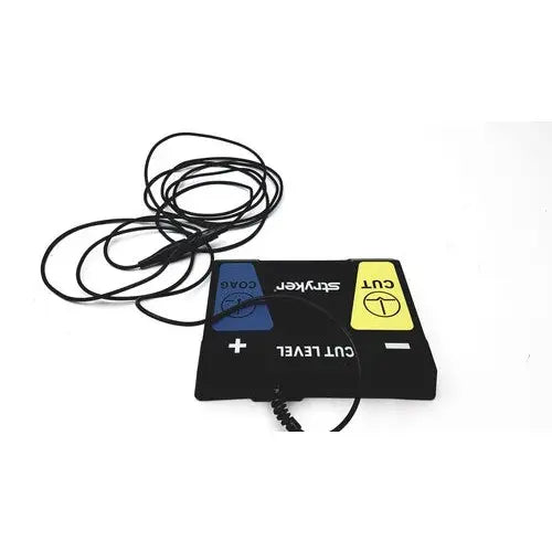 Black rectangular serfas energy footswitch with blue and yellow coax and cut buttons by stryker for reuse medical use