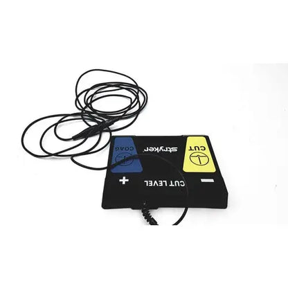 Black rectangular serfas energy footswitch with blue and yellow coax and cut buttons by stryker for reuse medical use