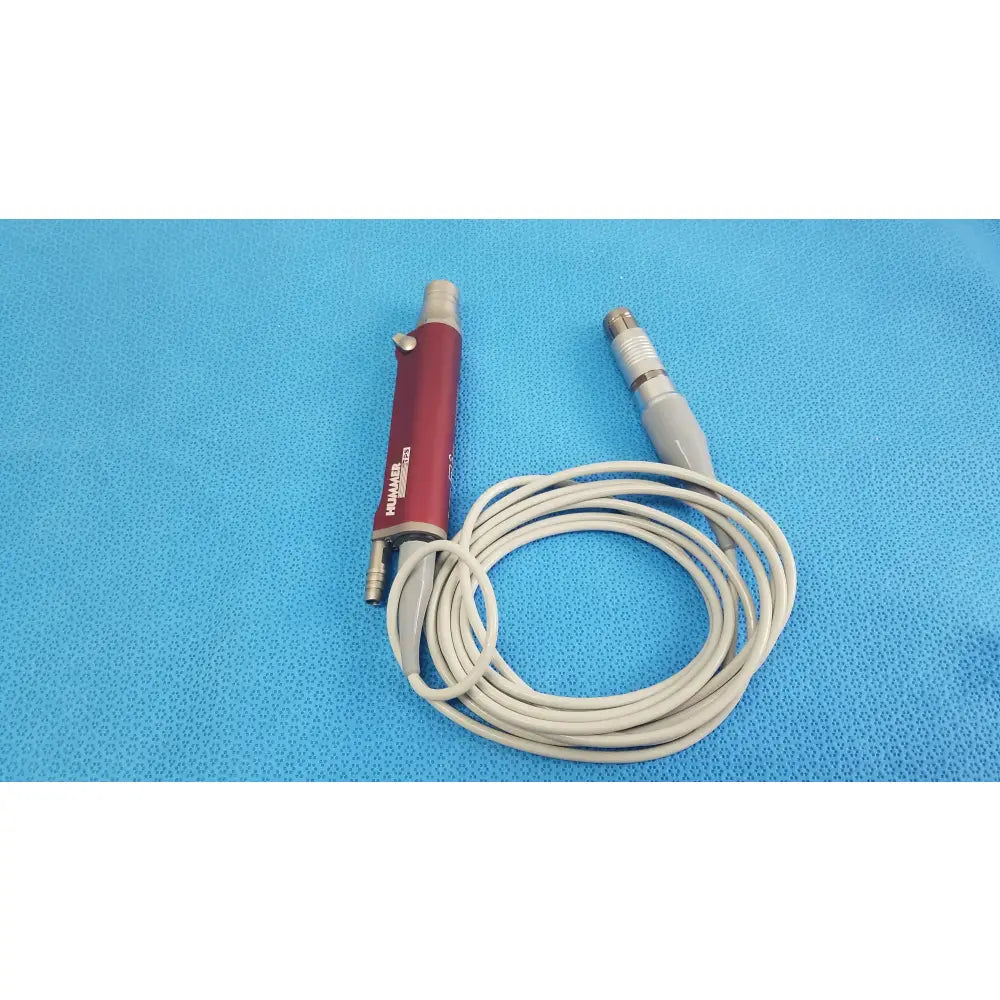 Red tps leibinger hummer shaver handpiece with silver connectors and beige coiled cable for medical use
