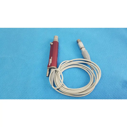Red tps leibinger hummer shaver handpiece with silver connectors and beige coiled cable for medical use