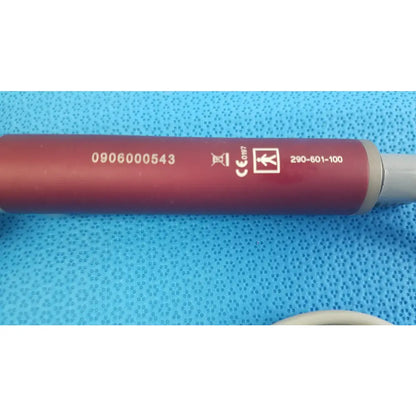 Red cylindrical tps leibinger hummer shaver handpiece with gray end cap and engraved serial number and certification marks