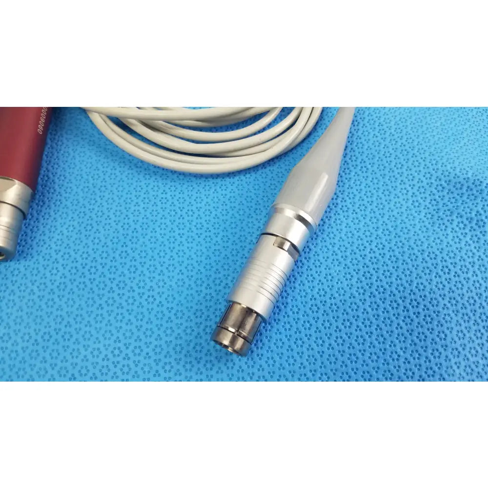 Silver and white tps leibinger hummer shaver handpiece cable with metallic connector for stryker 290-601-100 device