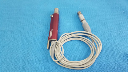 Red tps leibinger hummer shaver handpiece with silver connectors and beige coiled cable for medical use