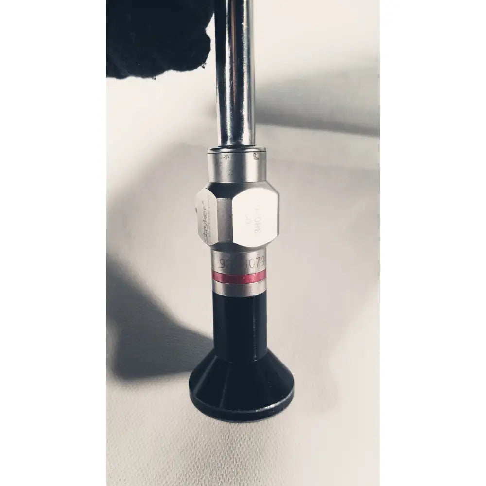 Stryker 380-10mm 0 degree rigid laparoscope with a silver metallic hexagonal joint and black rubber base