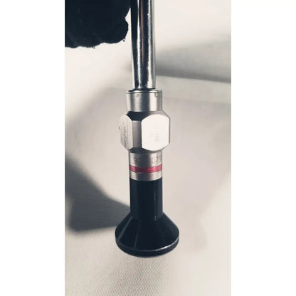 Stryker 380-10mm 0 degree rigid laparoscope with a silver metallic hexagonal joint and black rubber base