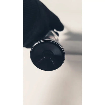 Black cylindrical flashlight with matte finish and textured grip used as a 380-10mm 0 degree rigid laparoscope tool