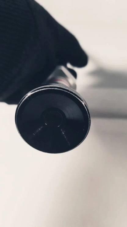 Black cylindrical flashlight with matte finish and textured grip used as a 380-10mm 0 degree rigid laparoscope tool
