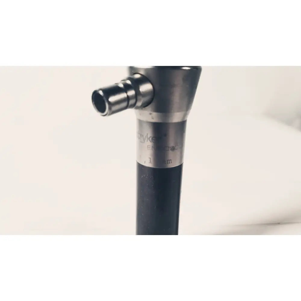A sleek metallic stryker 380-11 laparoscope 0 degree 10 mm with black grip suitable for reuse medical procedures