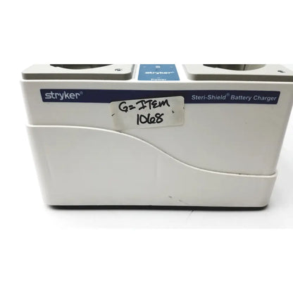 White stryker 400-655 steri-shield t4 eight station battery charger with blue branding and handwritten label