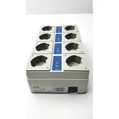 Gray plastic stryker 12-port surgical instrument tray with blue control panels for eight station battery charging