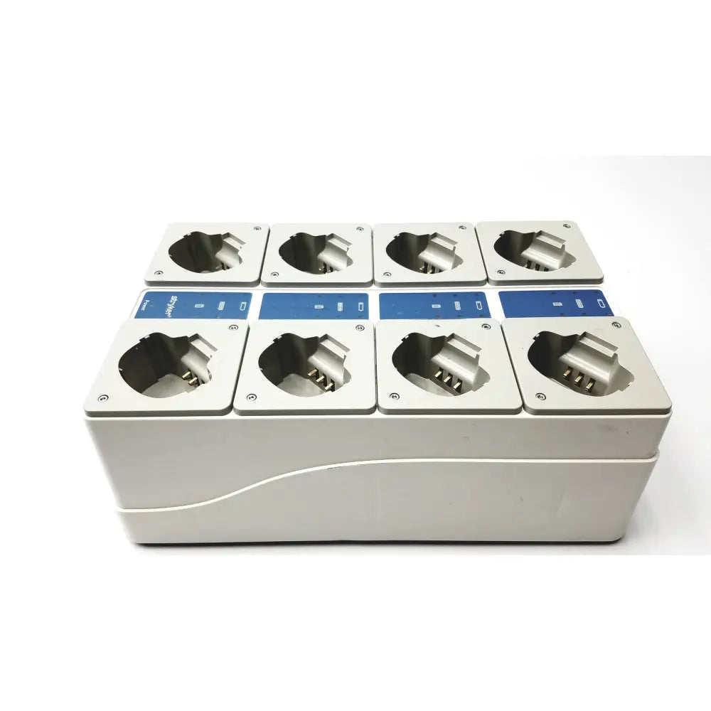 Stryker 400-655 Steri-Shield T4 white plastic eight station battery charger with eight silver metallic slots and blue labels