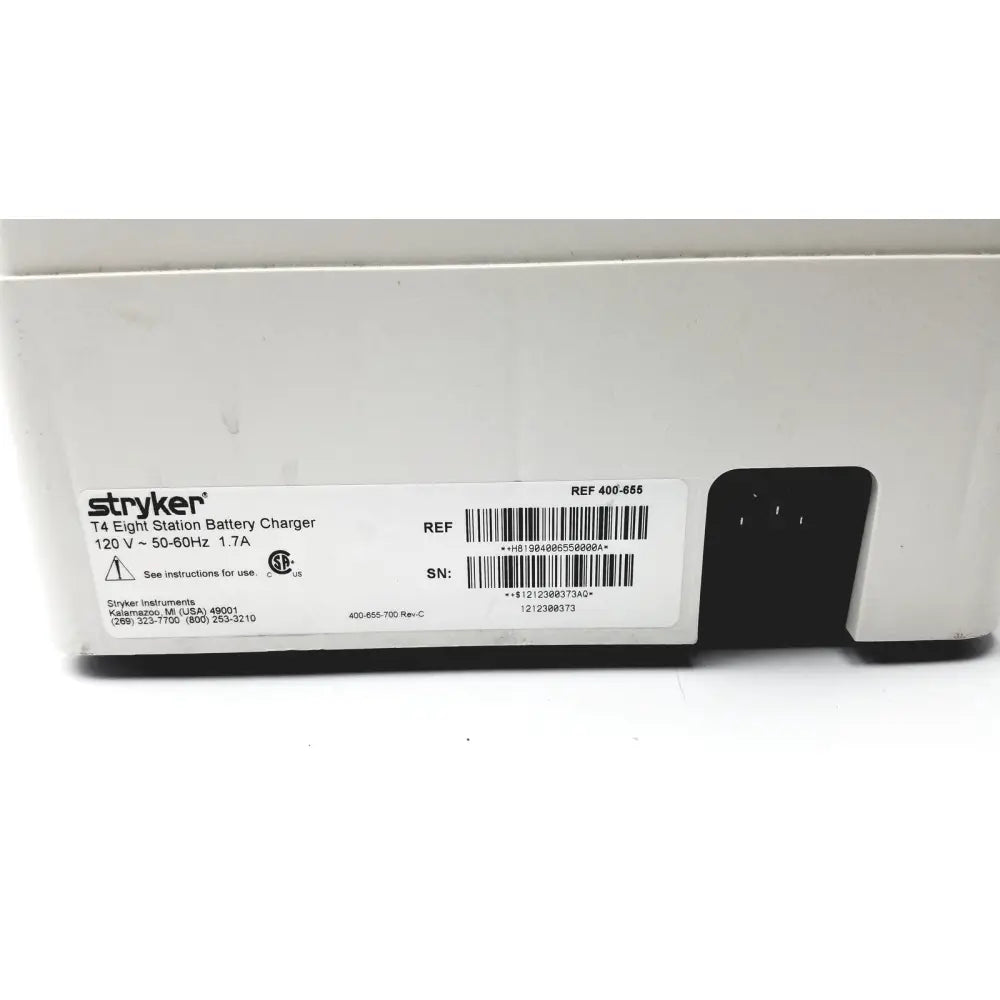 White plastic stryker 400-655 steri-shield t4 eight station battery charger with black power port and labeled specifications