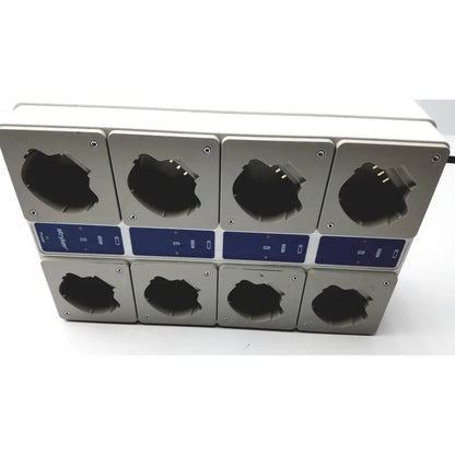 Silver rectangular stryker 400-655 steri-shield t4 eight station battery charger with blue control panels and black compartments