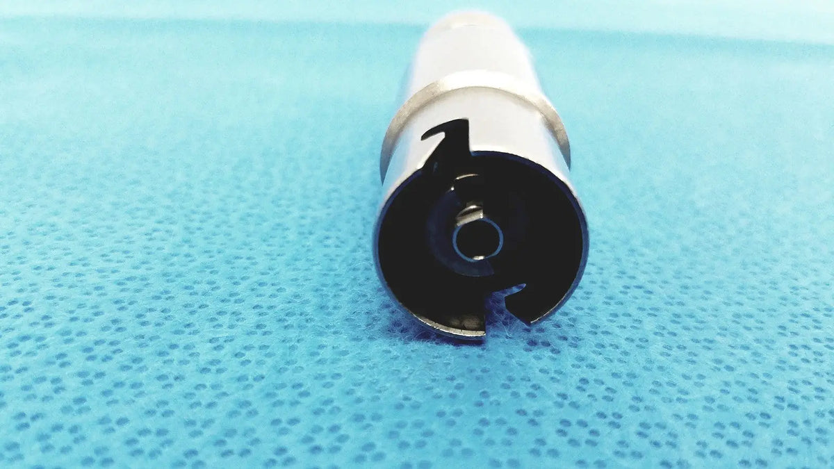 Silver and black metallic synthes style small drill attachment with cylindrical design for precise medical drilling