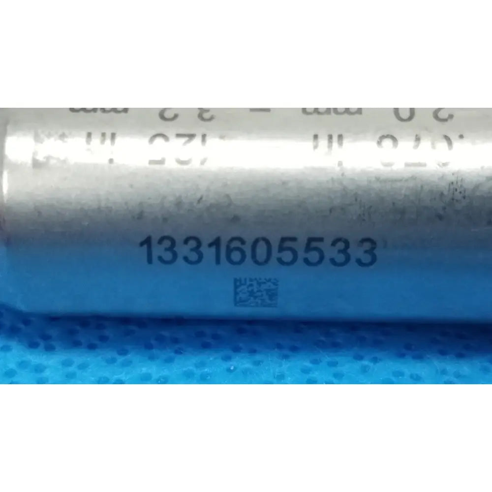 Silver cylindrical capacitor with blue label serial number 1331605533 for stryker 4100-125-00 pin collet reuse medical orthopedic instruments