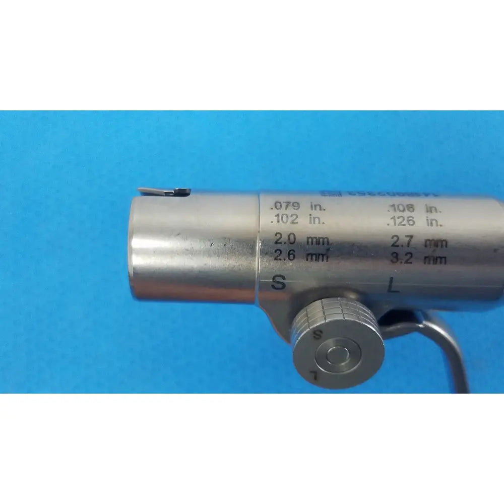 Silver metallic adjustable pin collet with engraved inch and millimeter measurements for reuse medical use