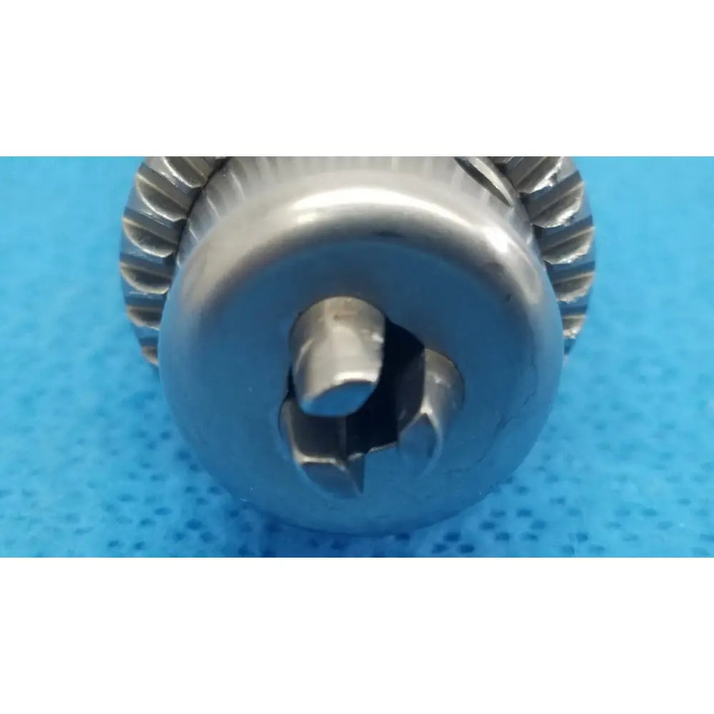 Stryker 4100-131-000 silver metal drill attachment with gear edge and central keyway for reuse medical applications
