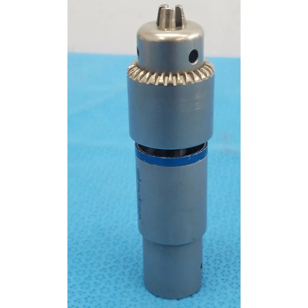 Stryker 4100-131-000 gray metallic 1/4 inch drill attachment with serrated gear and blue accent band for reuse medical use