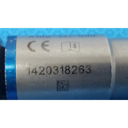 Stryker 4100-131-000 silver cylindrical drill attachment with blue end caps and serial number 1420318263 for reuse medical use