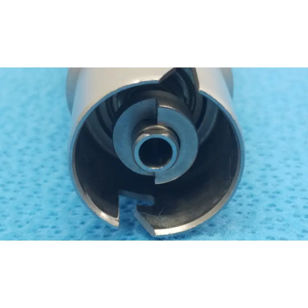 Silver metallic cylindrical reuse medical dental drill bit with hollow center and segmented edges for stryker keyless drill attachment
