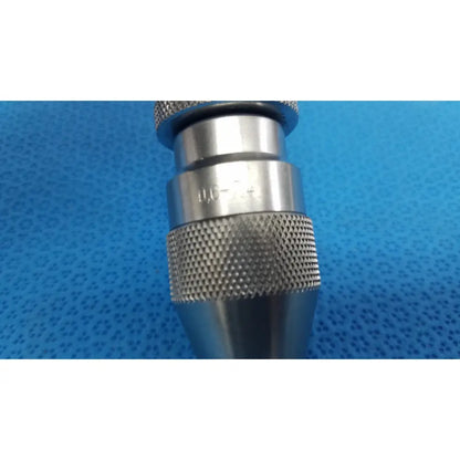 Stryker 4100-133-000 silver metal keyless drill attachment with textured knurled grip and engraved markings