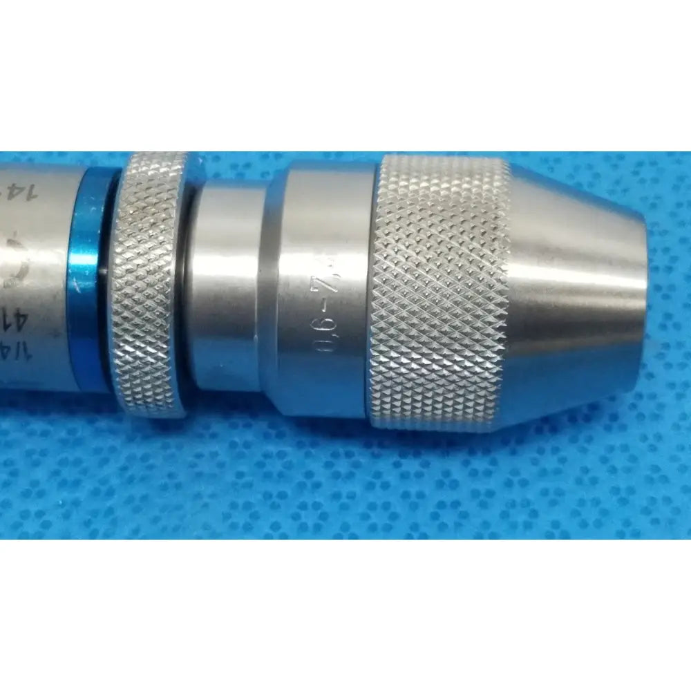 Stryker 4100-133-000 silver metallic keyless drill attachment with textured grip and blue accent band for 1/4 inch drill