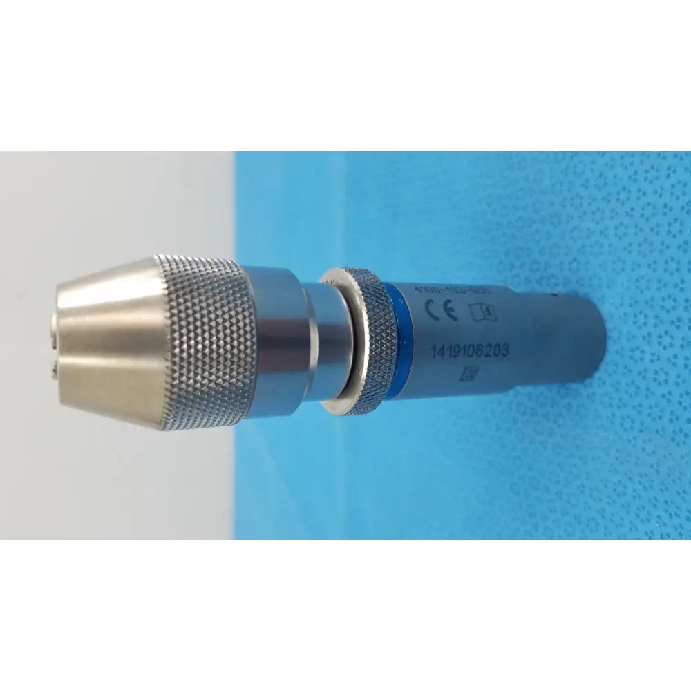Stryker 4100-133-000 silver keyless drill attachment with textured grip and blue labeling for surgical use