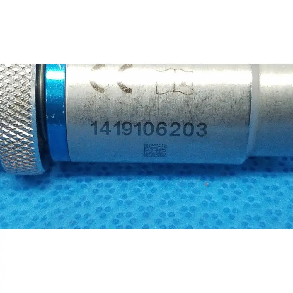 Stryker 4100-133-000 silver metallic keyless drill attachment with textured grip and blue accent band engraved serial number 1419106203