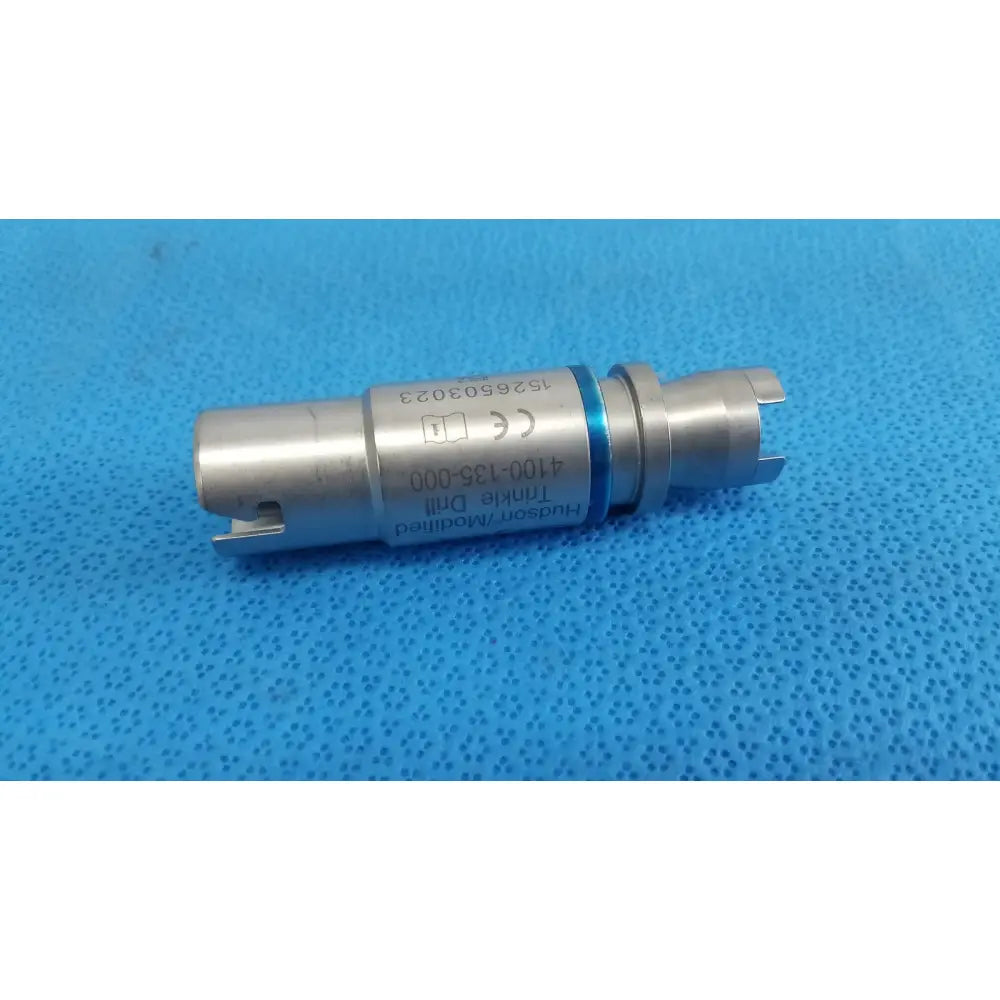 Silver-colored metal hudson modified trinkle drill bit with blue ring and engraved markings for surgical use by Stryker