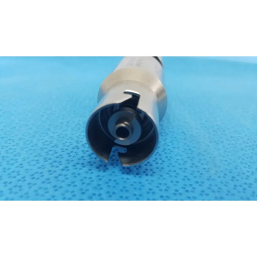 Silver metallic stryker 4100-210-000 ao large reamer attachment with cylindrical body and hollow gear-like end