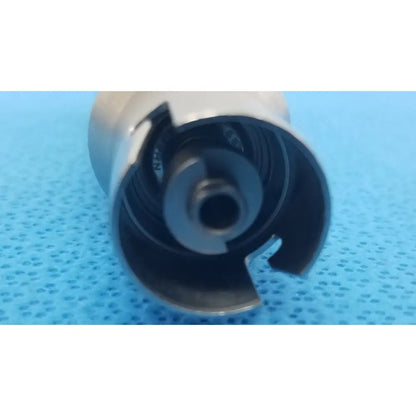 Silver metallic cylindrical stryker 4100-210-000 large reamer attachment with hollow center and segmented inner structure