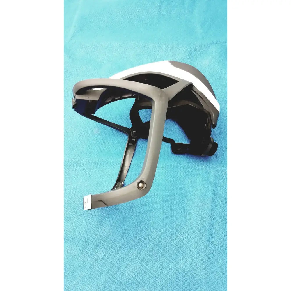 Gray and white stryker 416-600-000 surgical helmet with black interior straps and power cord protective headgear