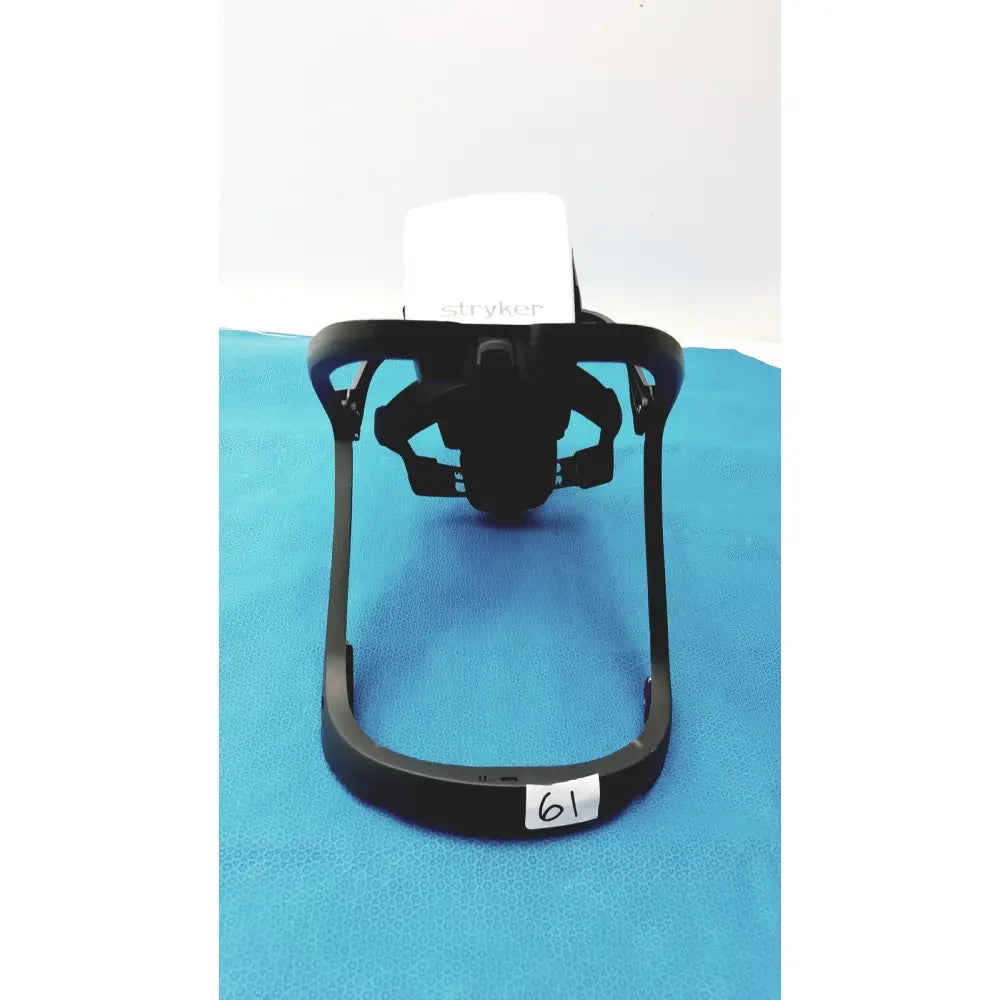 Black plastic headgear frame for stryker 416-600-000 surgical helmet with power cord protective features shown from back side