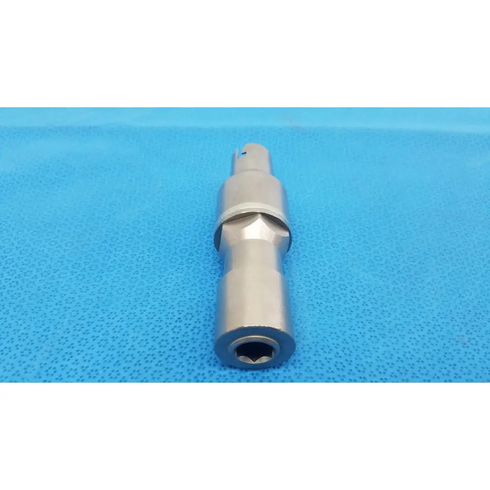 Silver metallic poweream large socket wrench adapter with hexagonal drive and machined grooves for reuse medical use