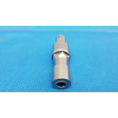 Silver metallic poweream large socket wrench adapter with hexagonal drive and machined grooves for reuse medical use