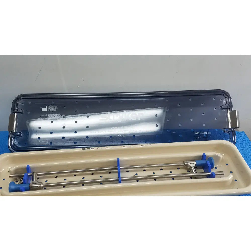 Stryker ideal eyes 10mm autoclavable surgical instrument tray with metallic rods and blue plastic handles for precise use